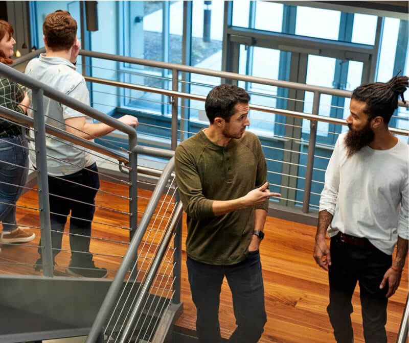 employees talking on stairway