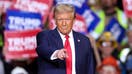 TOPSHOT - Former US President and Republican presidential candidate Donald Trump gestures during a campaign rally at PPG Paints Arena in Pittsburgh, Pennsylvania on November 4, 2024. 