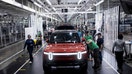 Workers assemble second-generation R1 vehicles at electric auto maker Rivian&apos;s manufacturing facility in Normal, Illinois, on June 21, 2024. 