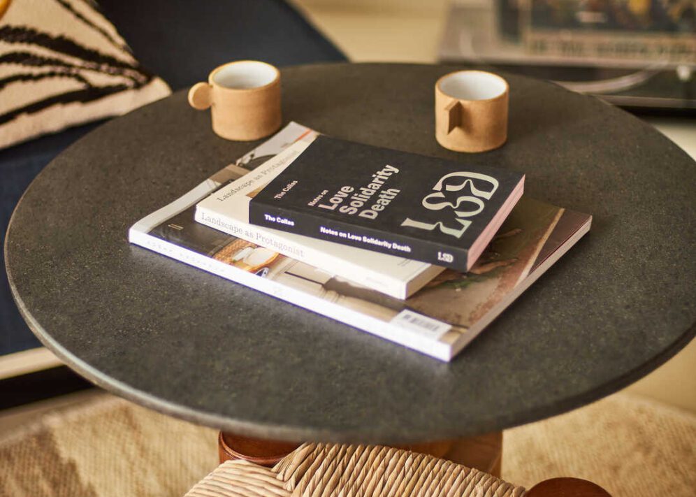 A stone table provides reading material local to the city