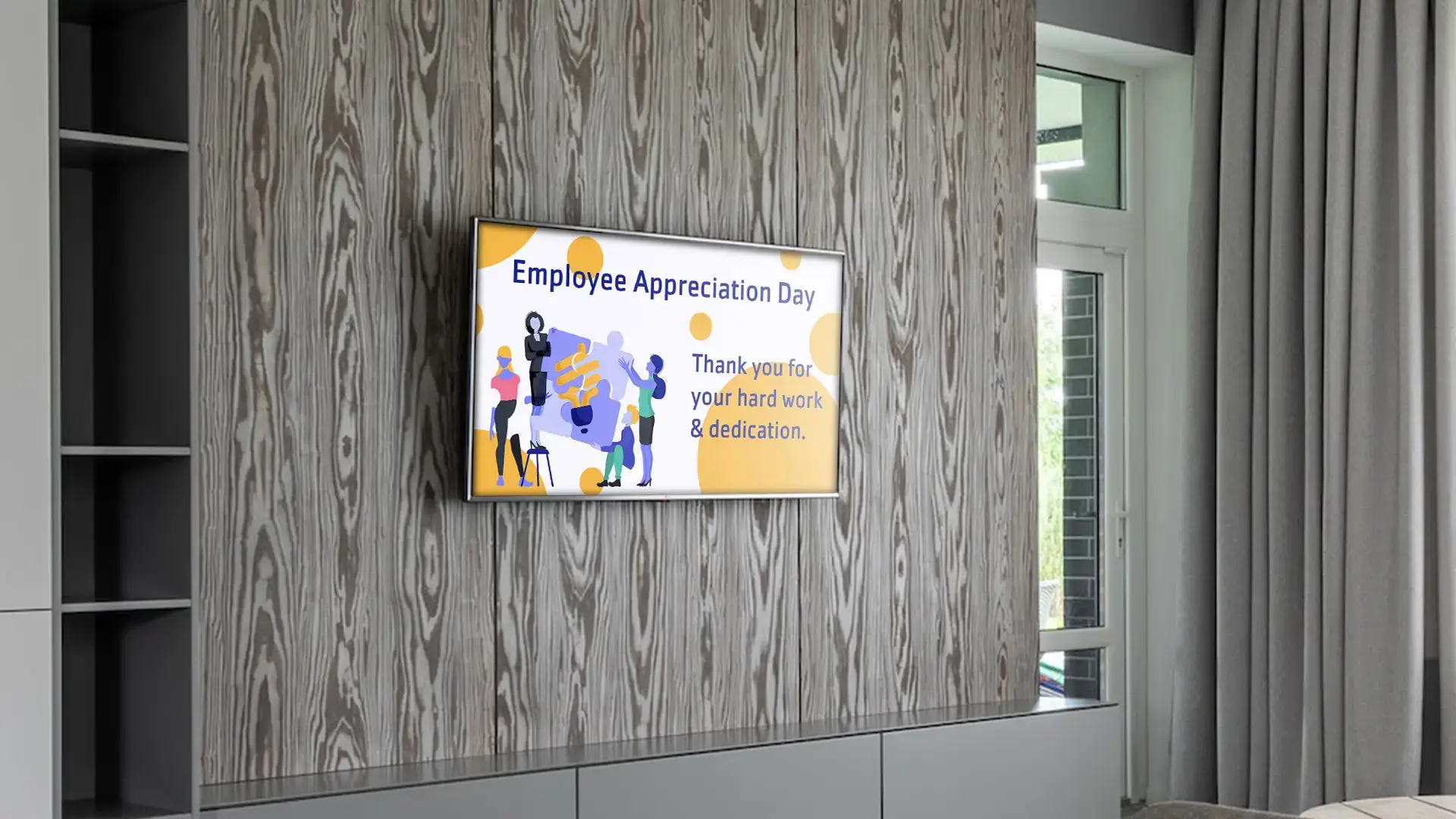 A digital screen on the wall displays a employee appreciation message