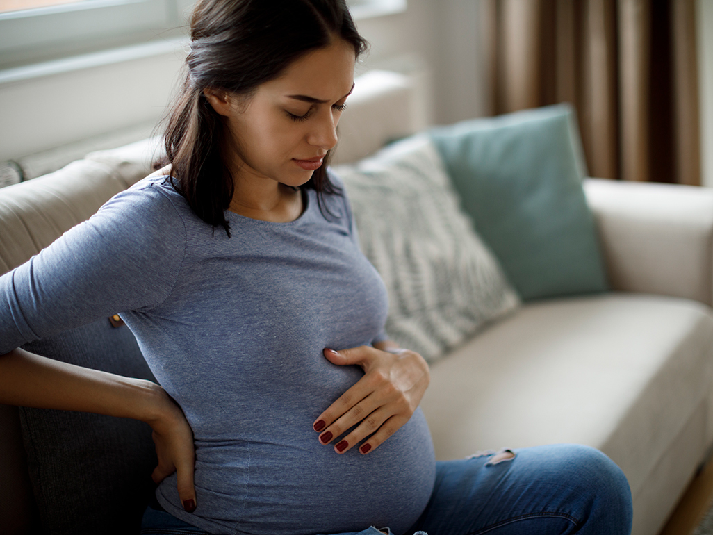 A pregnant woman having a contraction