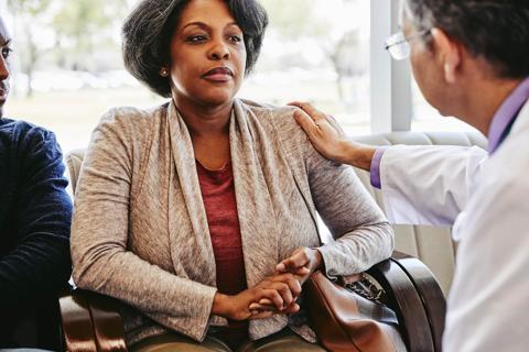 Doctor speaking with patient