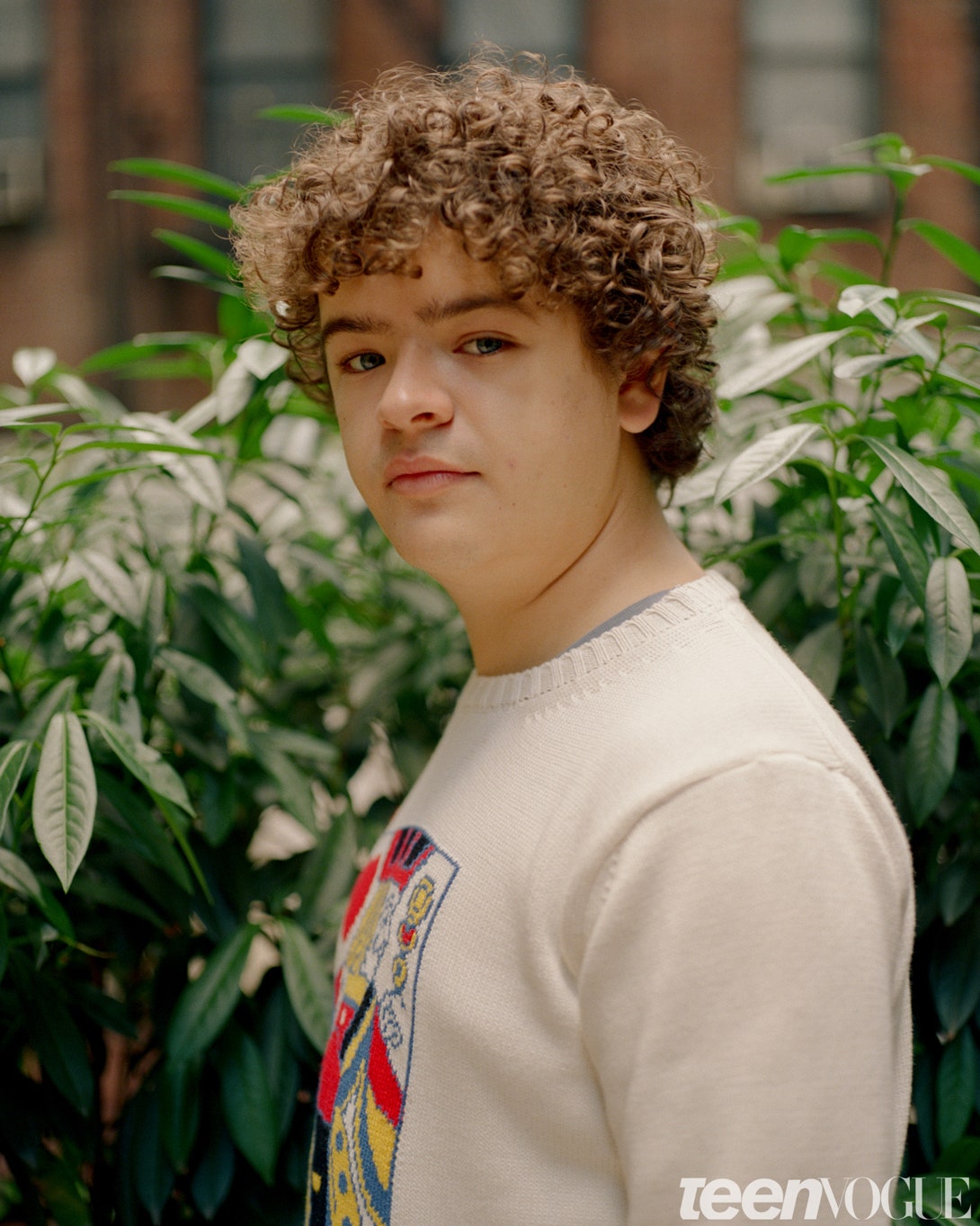 Image may contain Human Person Clothing Apparel Gaten Matarazzo and Plant