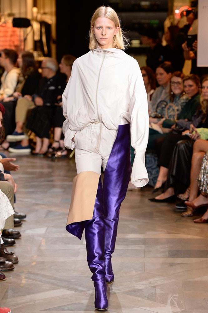 Image may contain Human Person Crowd Audience Clothing Apparel and Runway