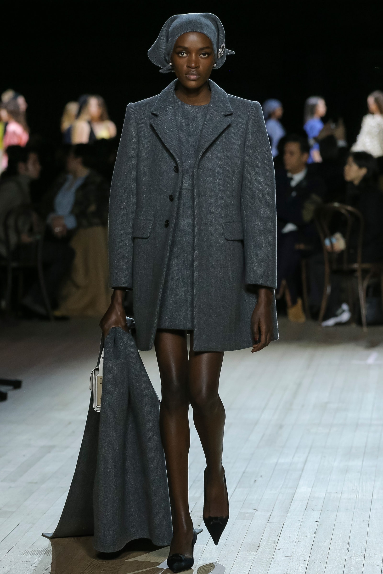 Image may contain Clothing Coat Apparel Human Person Fashion and Runway