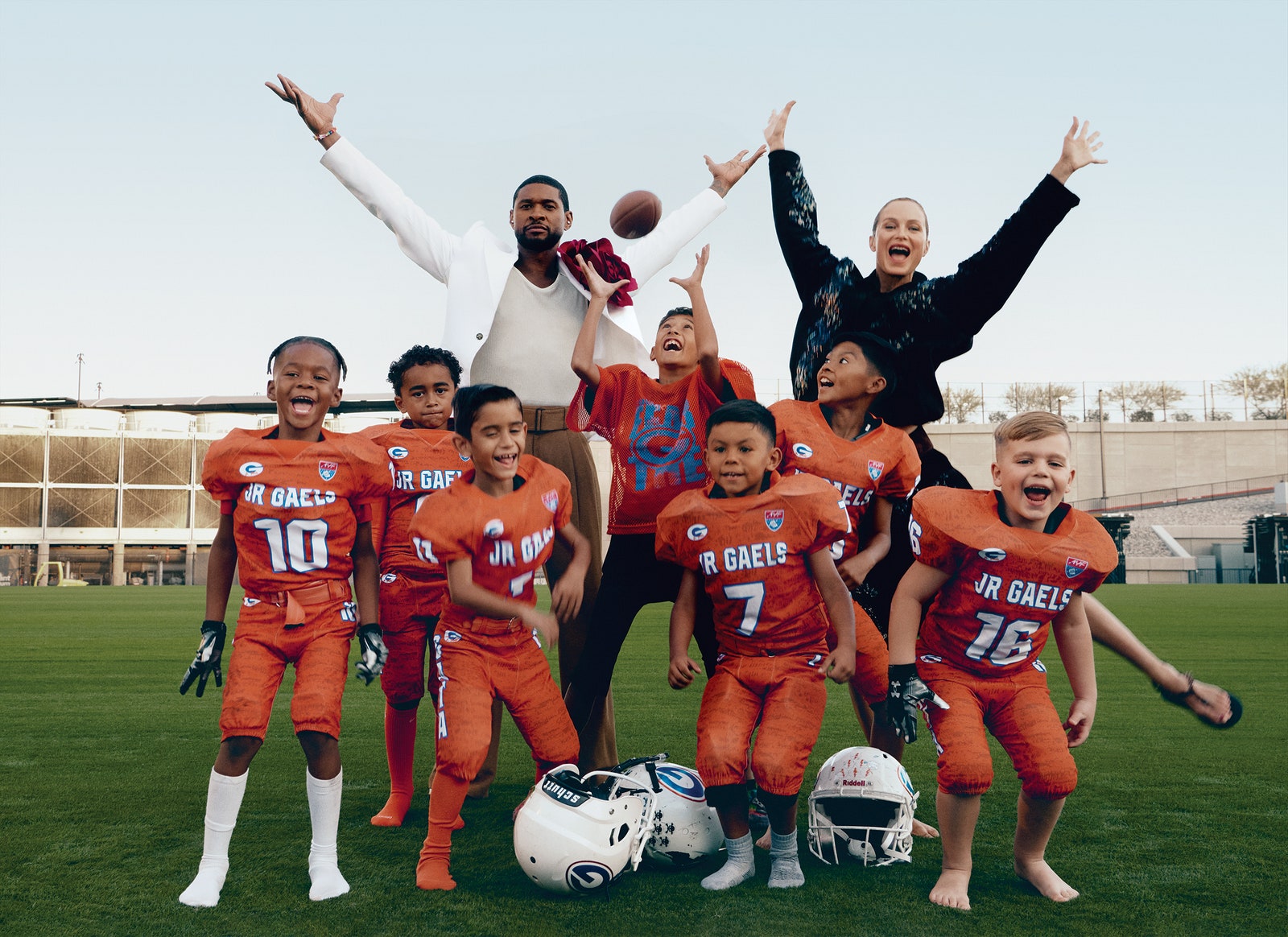 STARTING SQUAD Usher and Murphy fire up young members of the Jr Gaels 6U team. Usher wears a Willy Chavarria jacket and...