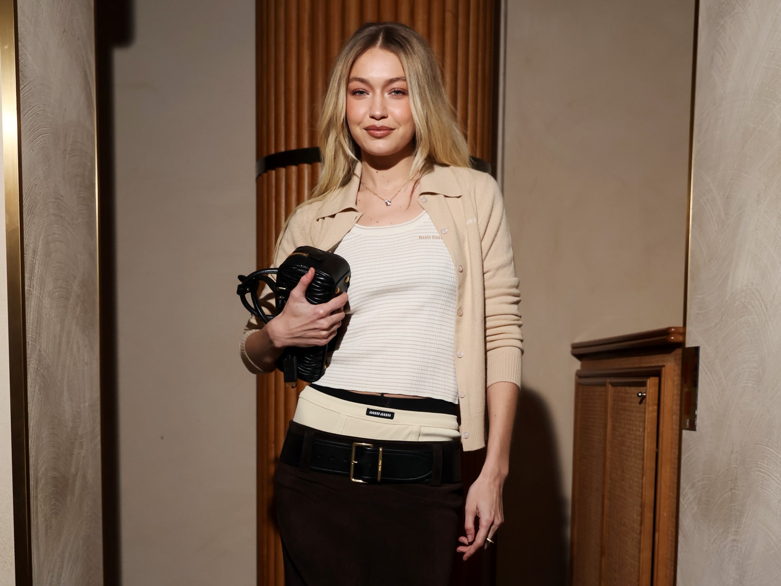 In An Awkward Skirt And Visible Knickers, Gigi Hadid Is The Ultimate Miu Miu Girl