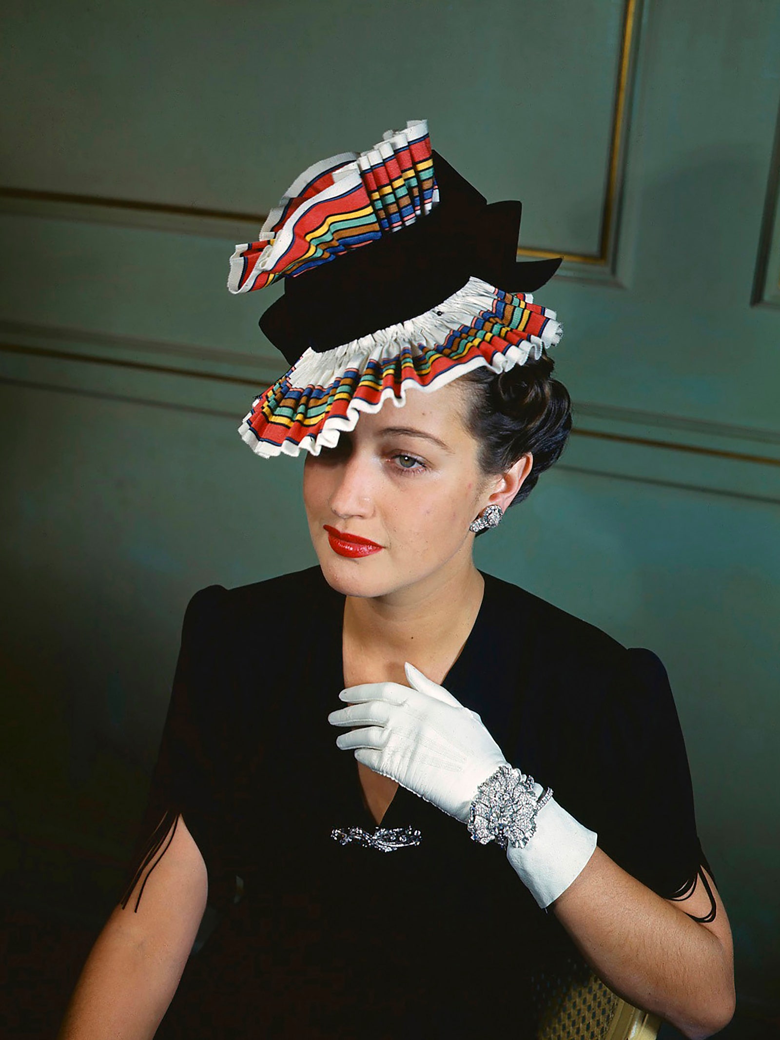 Image may contain Dorothy Lamour Person Clothing Glove Adult and Hat