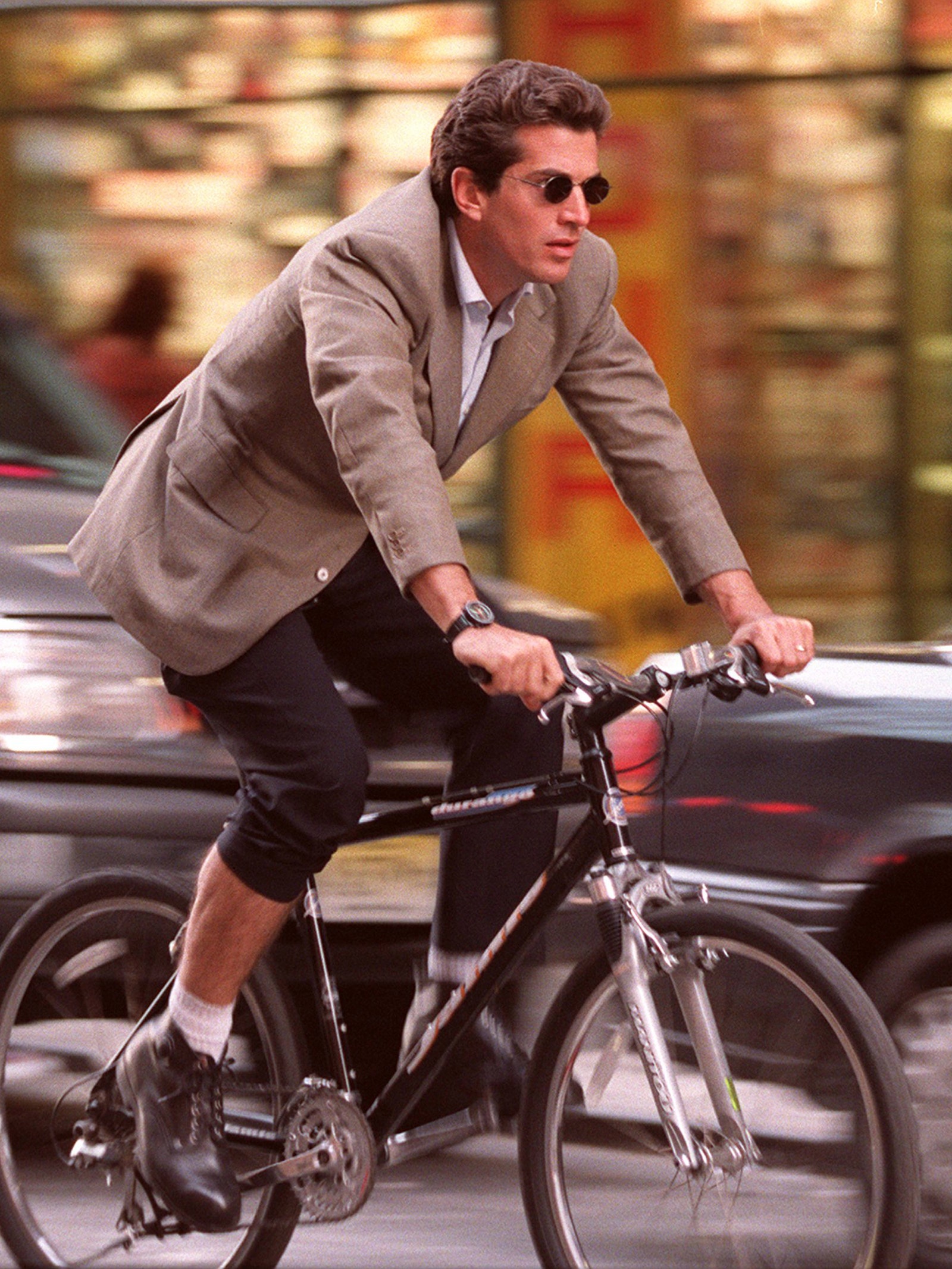 Image may contain John F. Kennedy Jr. Wristwatch Clothing Footwear Shoe Adult Person Bicycle Cycling and Sport