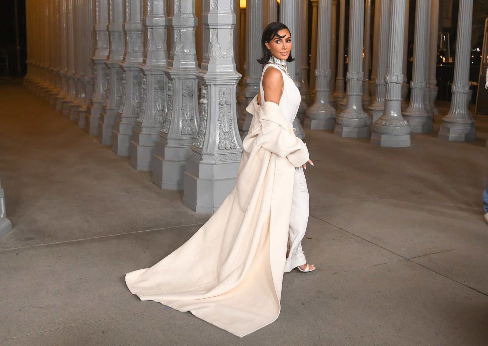 Image may contain Kim Kardashian Clothing Dress Fashion Formal Wear Gown Wedding Wedding Gown Adult and Person