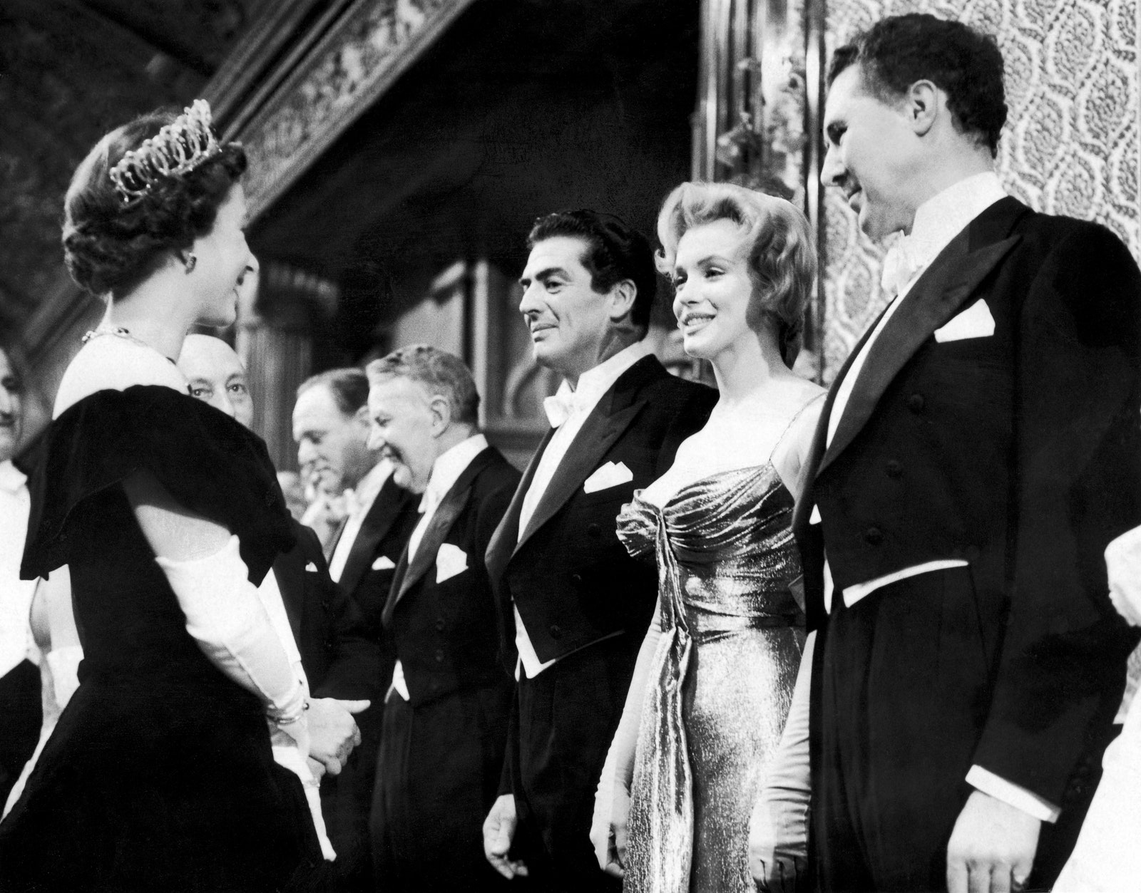 Image may contain Anthony Quayle Marilyn Monroe Victor Mature Elizabeth II Bernard Lee Person Adult and Wedding