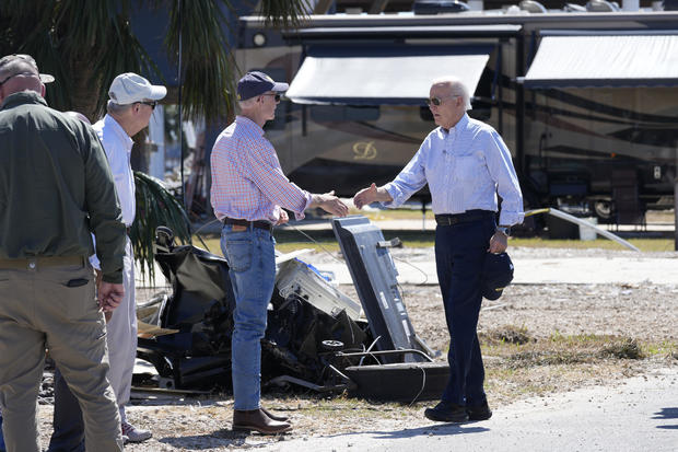 President Biden greets Republican Sen. Rick Scott of Florida and others in Keaton Beach, Florida, on Thursday, Oct. 3, 2024, during his tour of areas impacted by Hurricane Helene. 