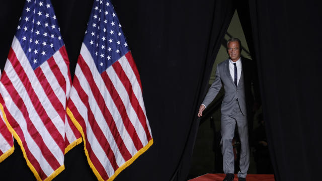 Robert F. Kennedy Jr. greets former President Donald Trump at a campaign event 