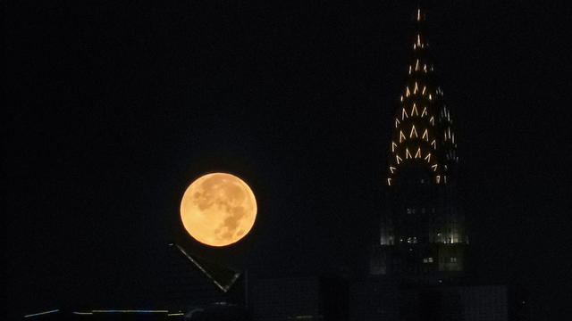 The Hunter's Supermoon sets over Manhattan, New York 