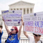 People demonstrate outside the Supreme Court.