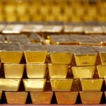 Gold bars are shown stacked in a vault at the United States Mint.