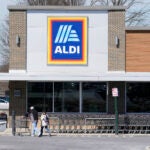 Customers walk into an Aldi supermarket.