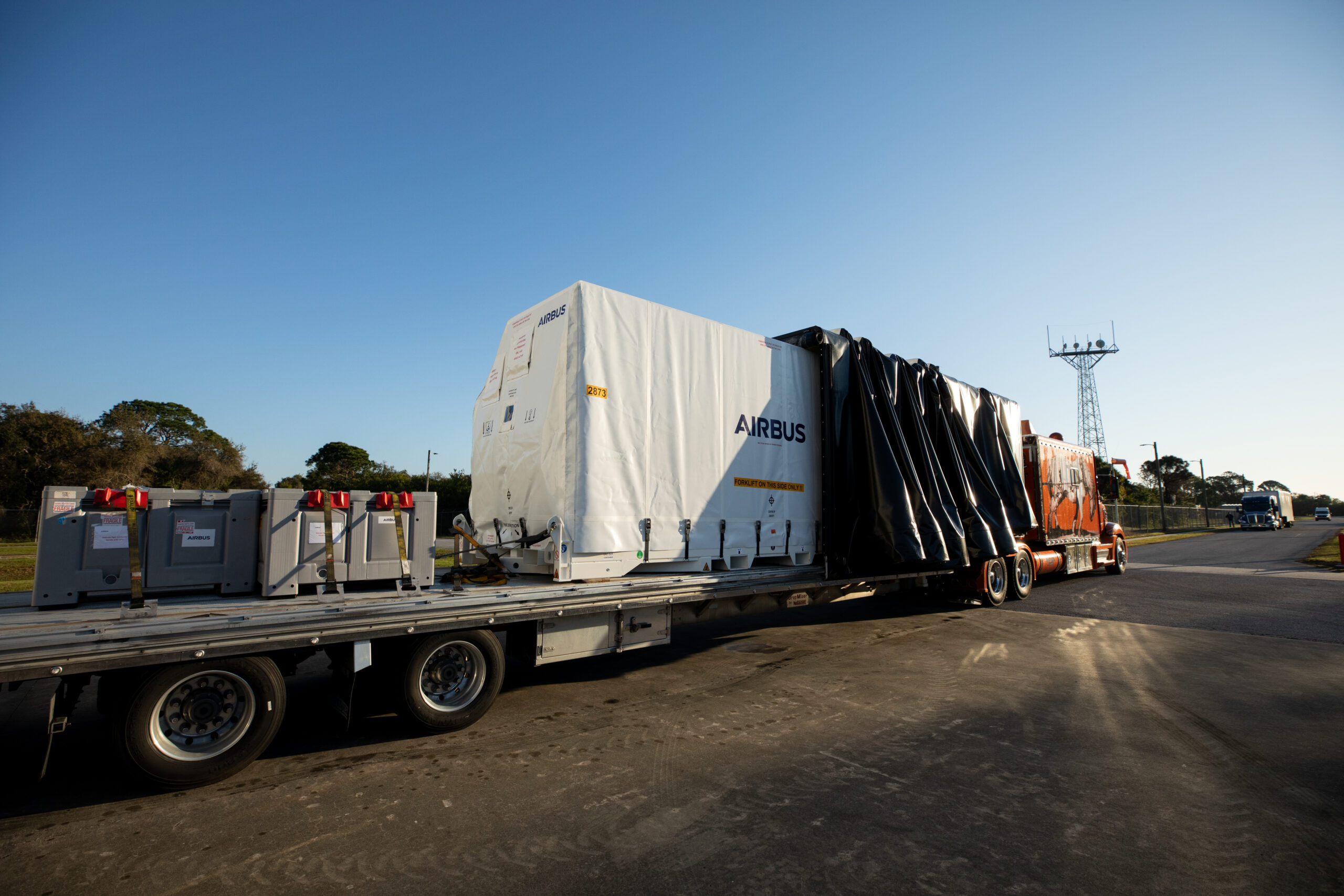 Container of five-panel solar arrays arrive Wed. Feb. 21 at Kennedy Space Center in Florida