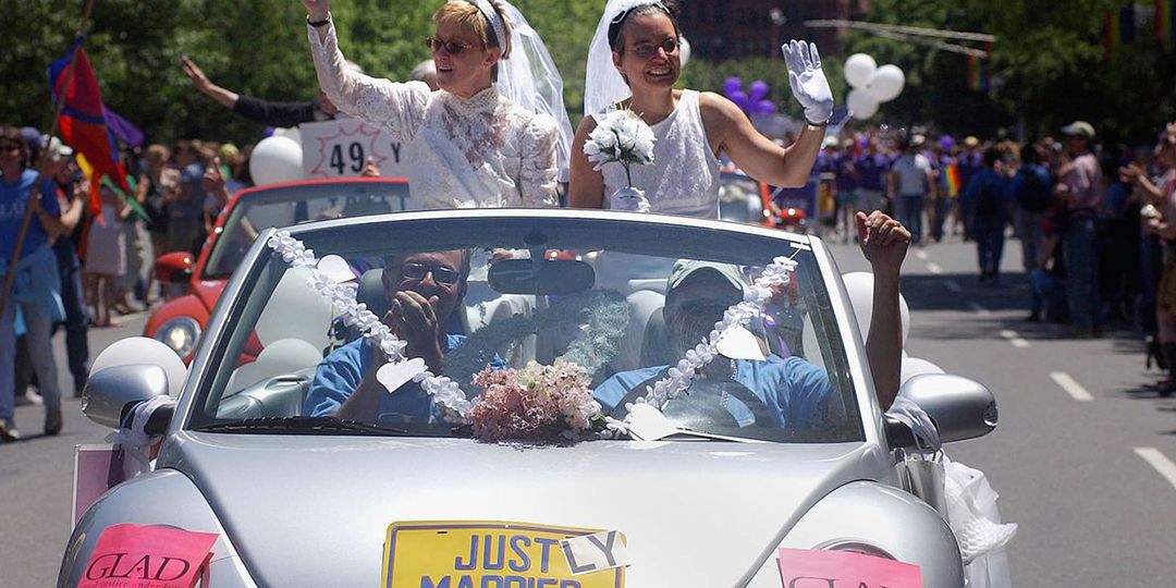 Moira Barrett (L) and Johanna Schulman, of Cambridge, ride in a car on June 12, 2004 during the 34th annual Boston Gay Pride Parade in Boston, Massachusetts. Getty Images