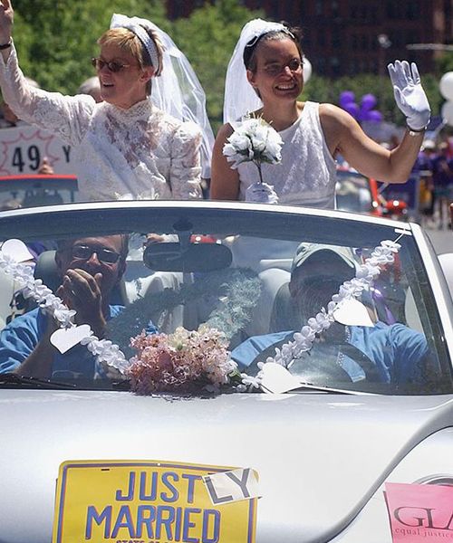 Moira Barrett (L) and Johanna Schulman, of Cambridge, ride in a car on June 12, 2004 during the 34th annual Boston Gay Pride Parade in Boston, Massachusetts. Getty Images