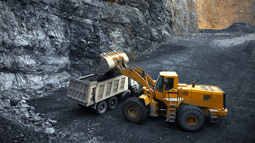 Bulldozer working in a mineral quarry.