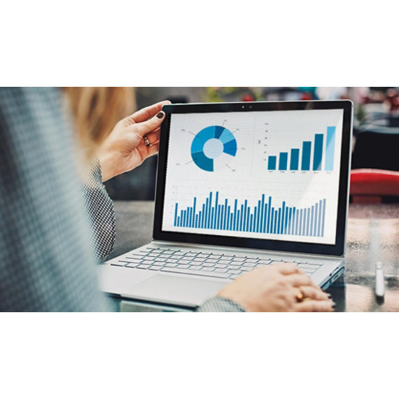 Mobile professional using a Surface Book and Surface Pen viewing a financial chart.