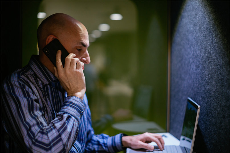 A person using a mobile phone for a call.