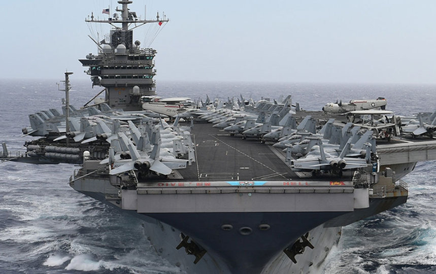 US Aircraft Carrier moving through ocean