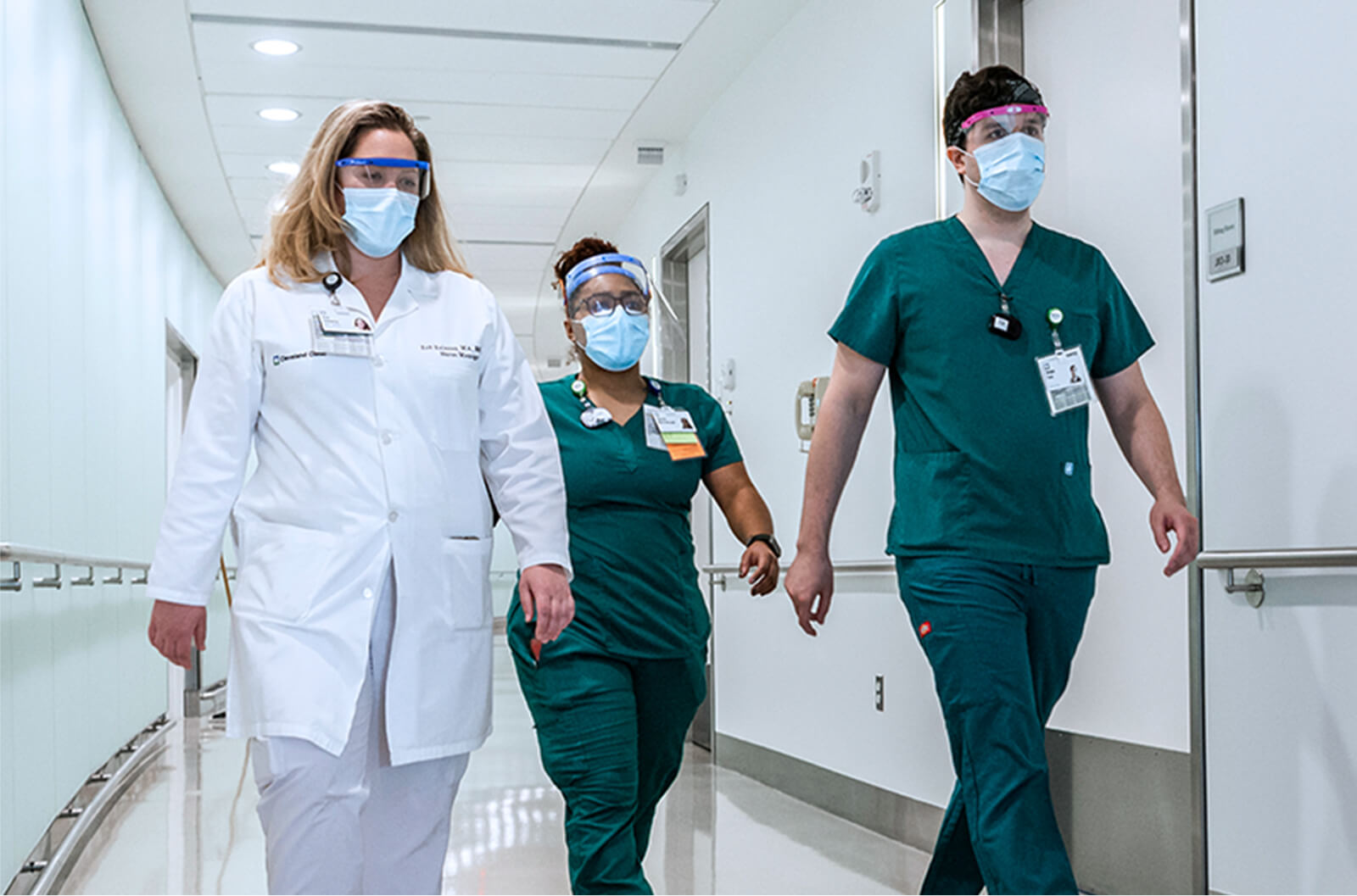 Medical professionals walking down a hallway