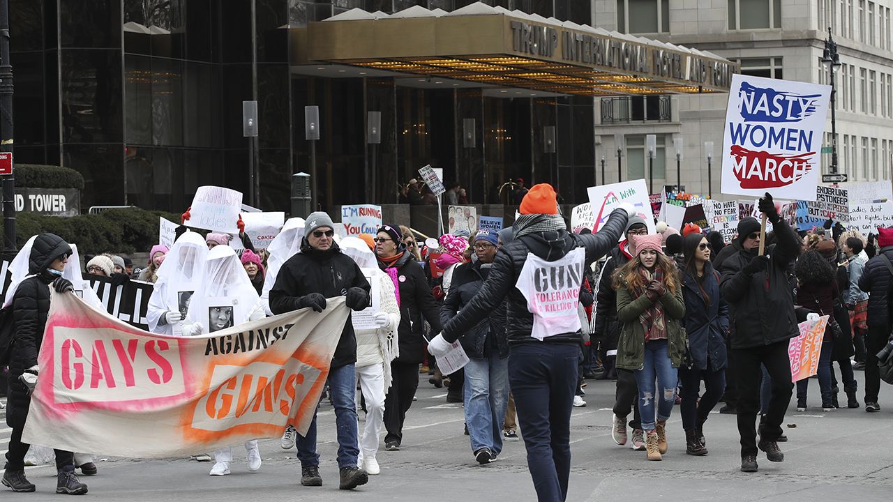 Demonstrators march past the Trump International Hotel and Tower during the Women's March Alliance, Saturday, Jan. 19, 2019, in New York.