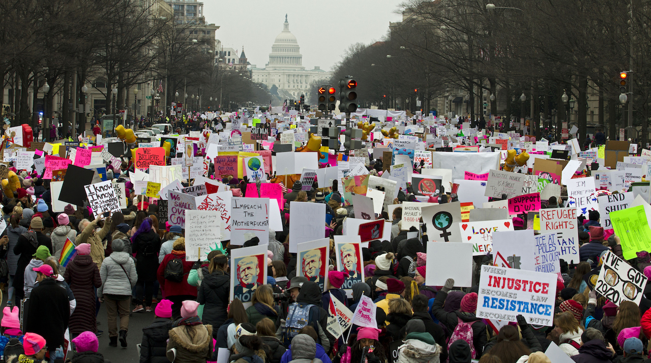 Demonstrators march on Pennsylvania Ave. during the Women's March in Washington on Saturday, Jan. 19, 2019.