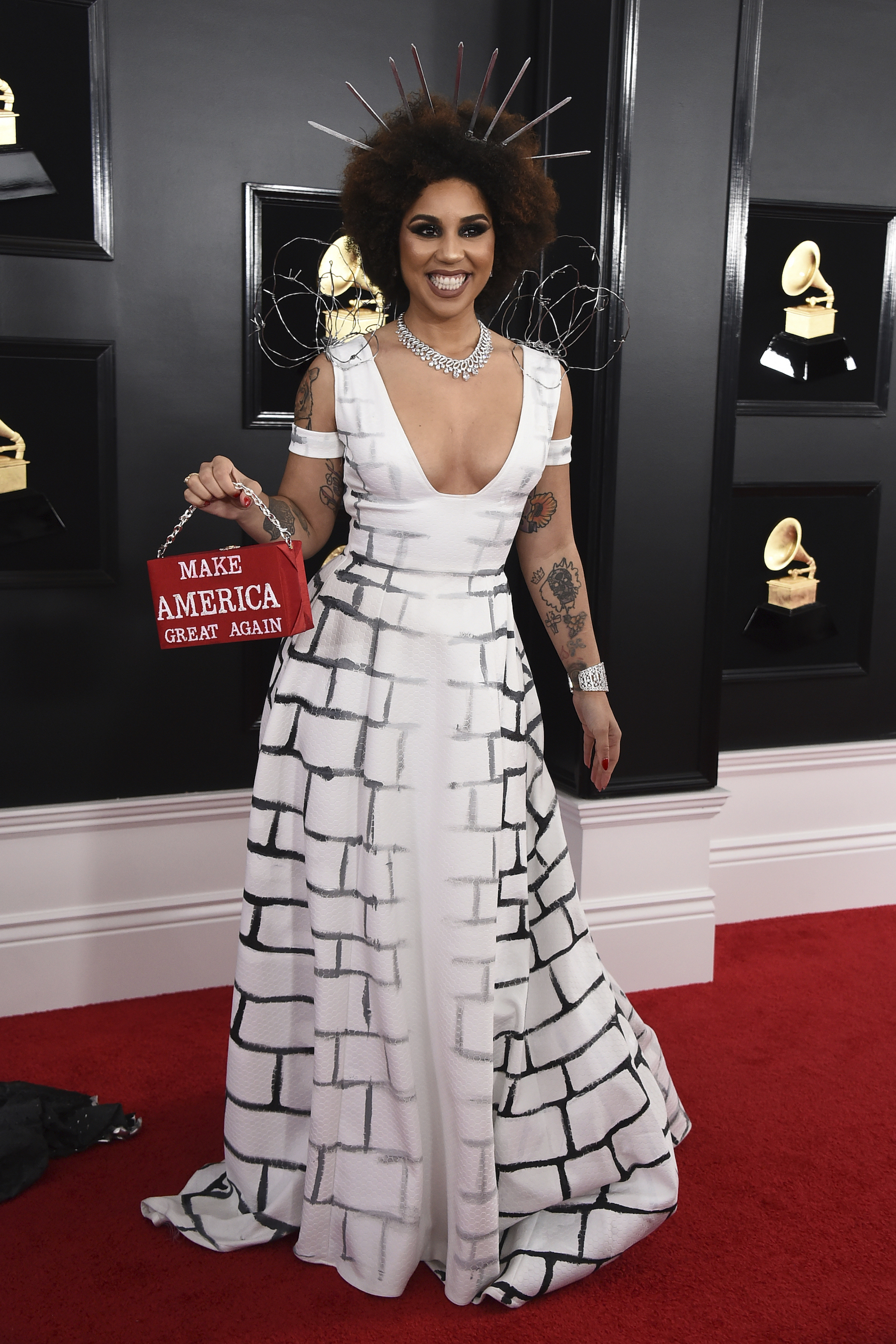 Joy Villa holds a purse that reads "Make America Great Again" at the 61st annual Grammy Awards at the Staples Center on Sunday, Feb. 10, 2019, in Los Angeles.