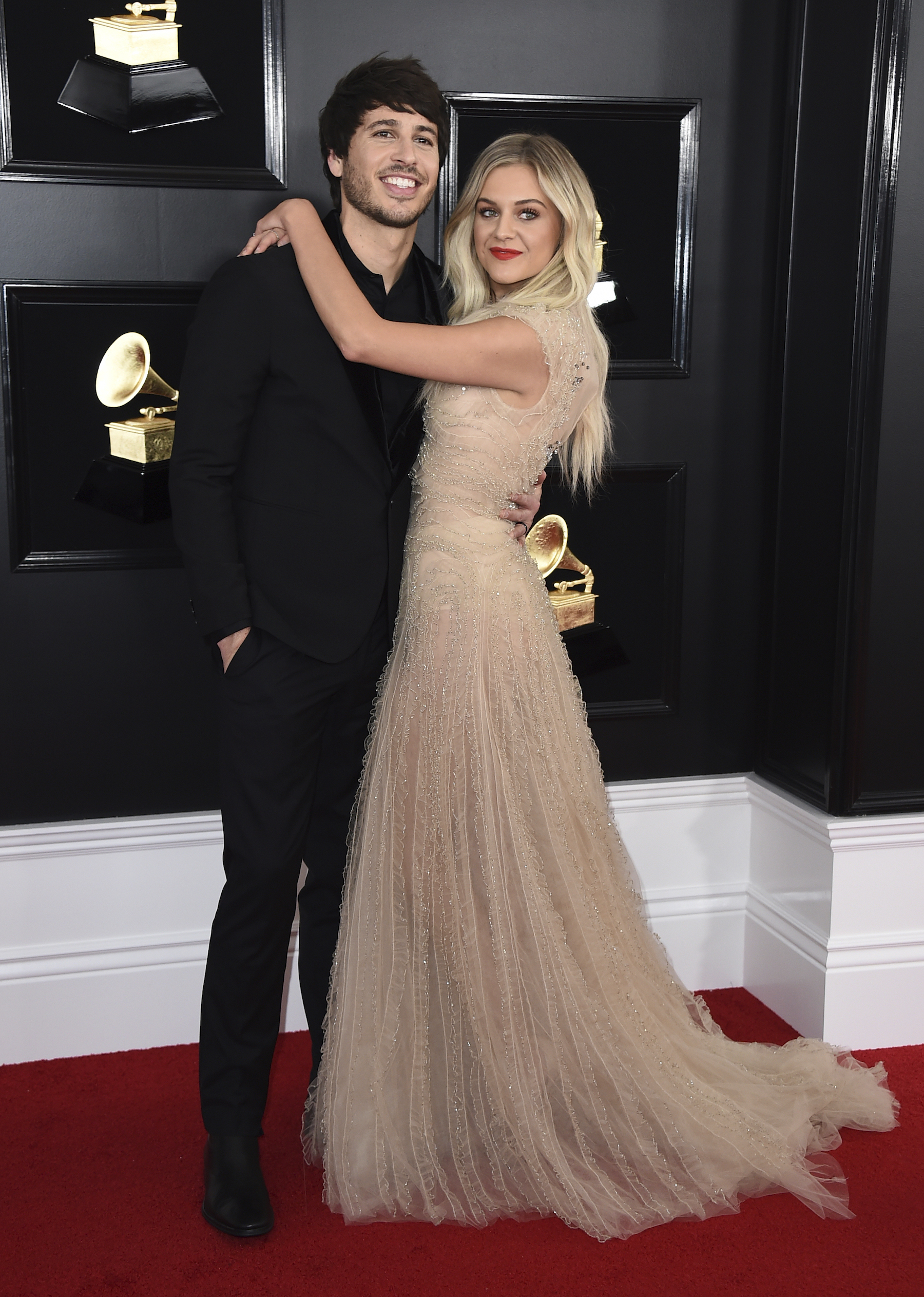 Morgan Evans, left, and Kelsea Ballerini arrive at the 61st annual Grammy Awards at the Staples Center on Sunday, Feb. 10, 2019, in Los Angeles.