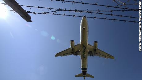 An Airbus A320 bearing the Alitalia livery lands at Rome&#39;s Fiumicino airport on June 3, 2020, as airports and borders reopen for tourists and residents free to travel across the country, within the COVID-19 infection, caused by the novel coronavirus. (Photo by Filippo MONTEFORTE / AFP) (Photo by FILIPPO MONTEFORTE/AFP via Getty Images)