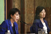 In this Sept. 18, 2021, file photo, Sanae Takaichi, left, and Seiko Noda, both former internal affairs ministers and candidates for the presidential election of the ruling Liberal Democratic Party, attend a debate session held by the Japan National Press Club in Tokyo. (AP Photo/Eugene Hoshiko, Pool)