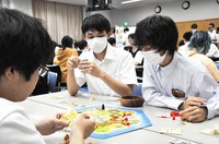 High school students are seen engaged in a game of Catan at the National Olympics Memorial Youth Center in Tokyo's Shibuya Ward on June 11, 2023. (Mainichi/Yuta Hiratsuka)