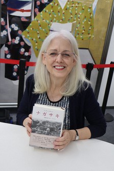 Susan Southard is seen with her book "Nagasaki: Life After Nuclear War" after her talk in Hiroshima's Naka Ward on Oct. 18, 2023. (Mainichi/Chinami Takeichi)