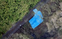 The area where the bodies were found, covered with a blue sheet, is pictured in this photo taken from a Mainichi Shimbun helicopter. (Mainichi/Kentaro Ikushima)