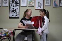 Mariia Dereviyanko, 14, left, helps her younger sister, who entered elementary school this spring, prepare for school. Mariia is a member of the calligraphy club at her junior high school in Japan and has also continued to take classes online at her school in Ukraine. She is interested in biology and other subjects, but cannot yet imagine what she will be doing a year from now. (Mainichi/Daisuke Wada)