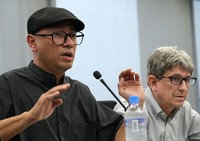 Aung Myat Win from Myanmar, left, and Simon Cole from Britain are seen in Osaka's Kita Ward on May 23, 2024. (Mainichi/Takashi Murata) 