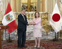 Japanese Prime Minister Shigeru Ishiba, left, and Peruvian President Dina Boluarte shake hands during a joint press conference following their talks at the presidential office in Lima on Nov. 17, 2024. (Kyodo)