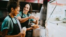 Two food truck workers