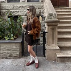 Robin Reetz in New York City wearing the corduroy trend with a brown suede jacket and loafers.