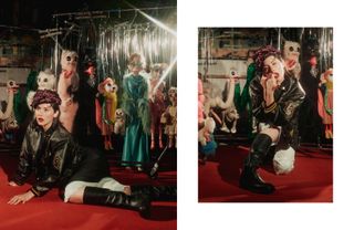 Two side-by-side photos of Gracie Abrams on the set of Who What Wear's fall issue cover shoot wearing a F/W 24 Prada cap, leather letterman jacket, skirt, pants, and boots in front of a bunch of puppets at a marionette theatre.