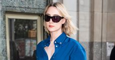 Saoirse Ronan is seen in Madison Square Park on October 01, 2024 in New York City wearing a navy blue shirt and matching corduroy pants by Ferragamo.