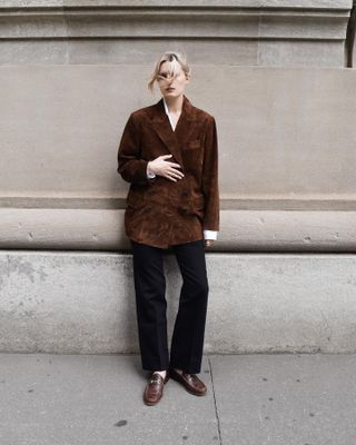 Stylish Christie Tyler wears Madewell x Alexa Chung collaboration suede jacket, jeans, and brown loafers.