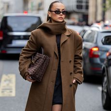 woman in brown scarf coat