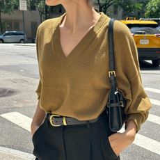 Woman wearing a V-neck sweater in NYC