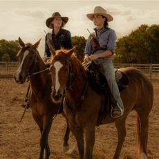 Anna Torv as Emily Lawson and Phillippa Northeast as Susie Lawson, both on horseback in the Australian outback, in 'Territory'